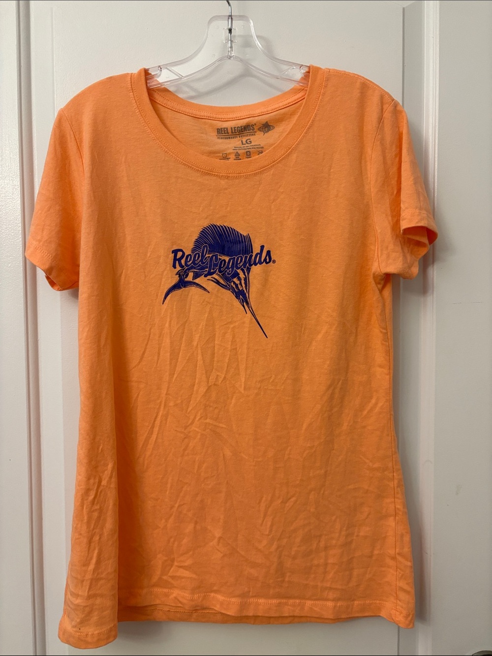 Reel Legends Coral Orange Tee with Navy Marlin Graphic